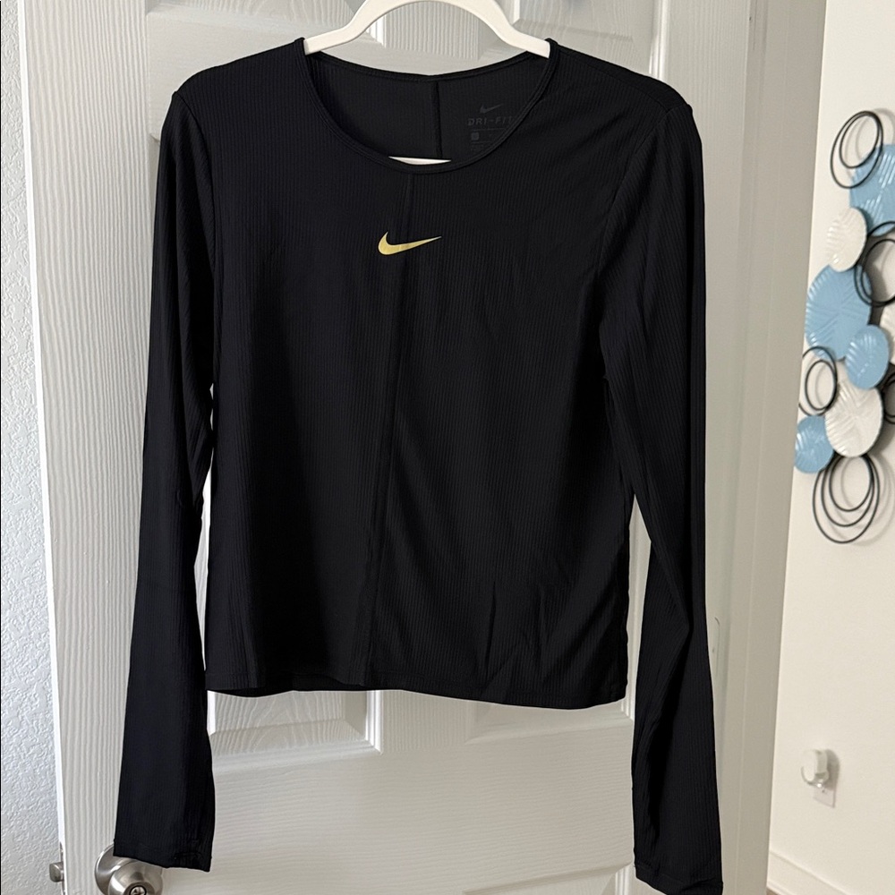 Nike Women's Black Long Sleeve Tee with Gold Swoosh